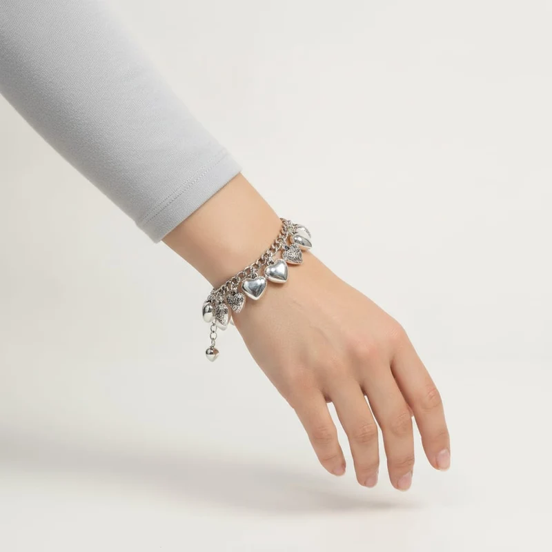 Bracciale di cuori lisci e intarsiati - Argento