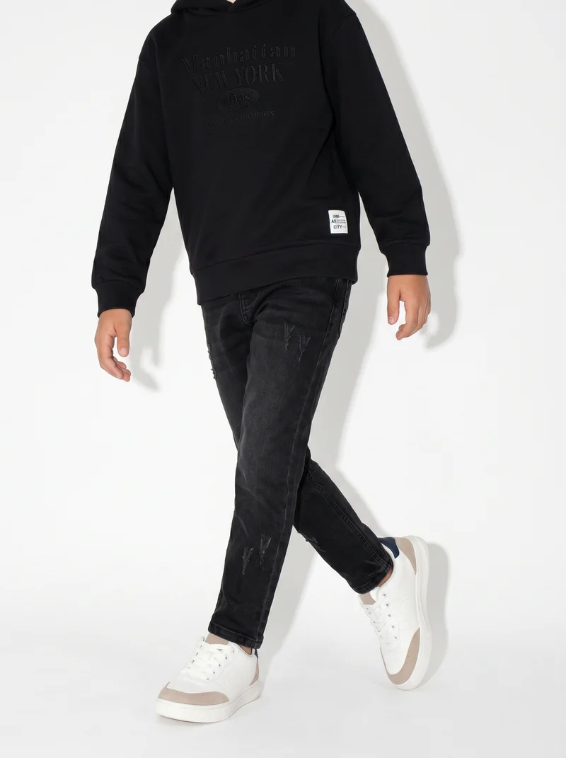 Jogging denim skinny con stile college - Nero