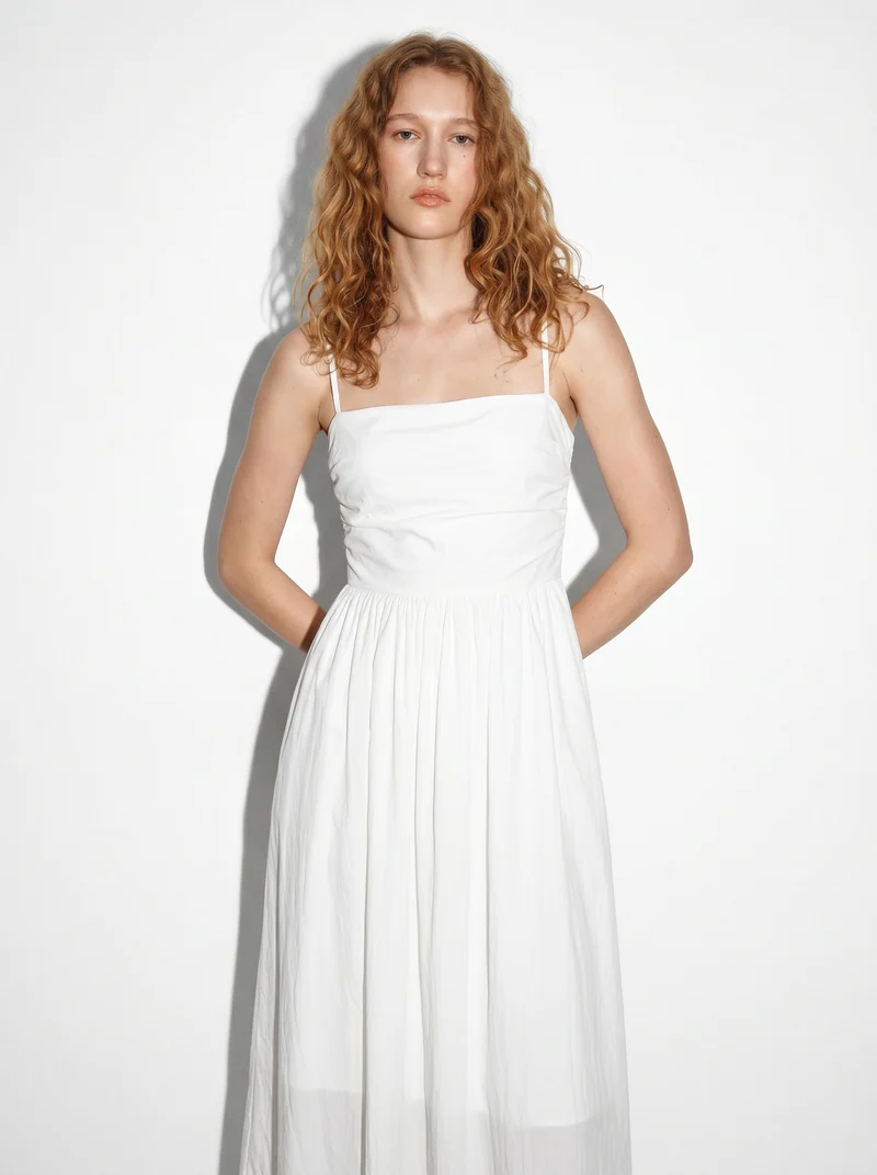 Vestito lungo con corpetto a costine e tasche - Bianco