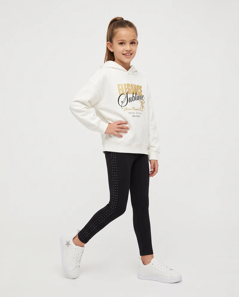 Leggings in interlock con borchie laterali - Nero