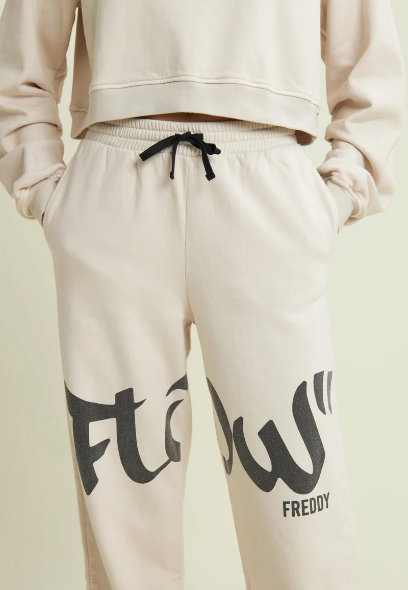 Flow print fleece trousers with gathered bottoms