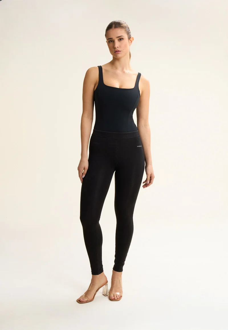 Breathable bodysuit with figure-enhancing seams