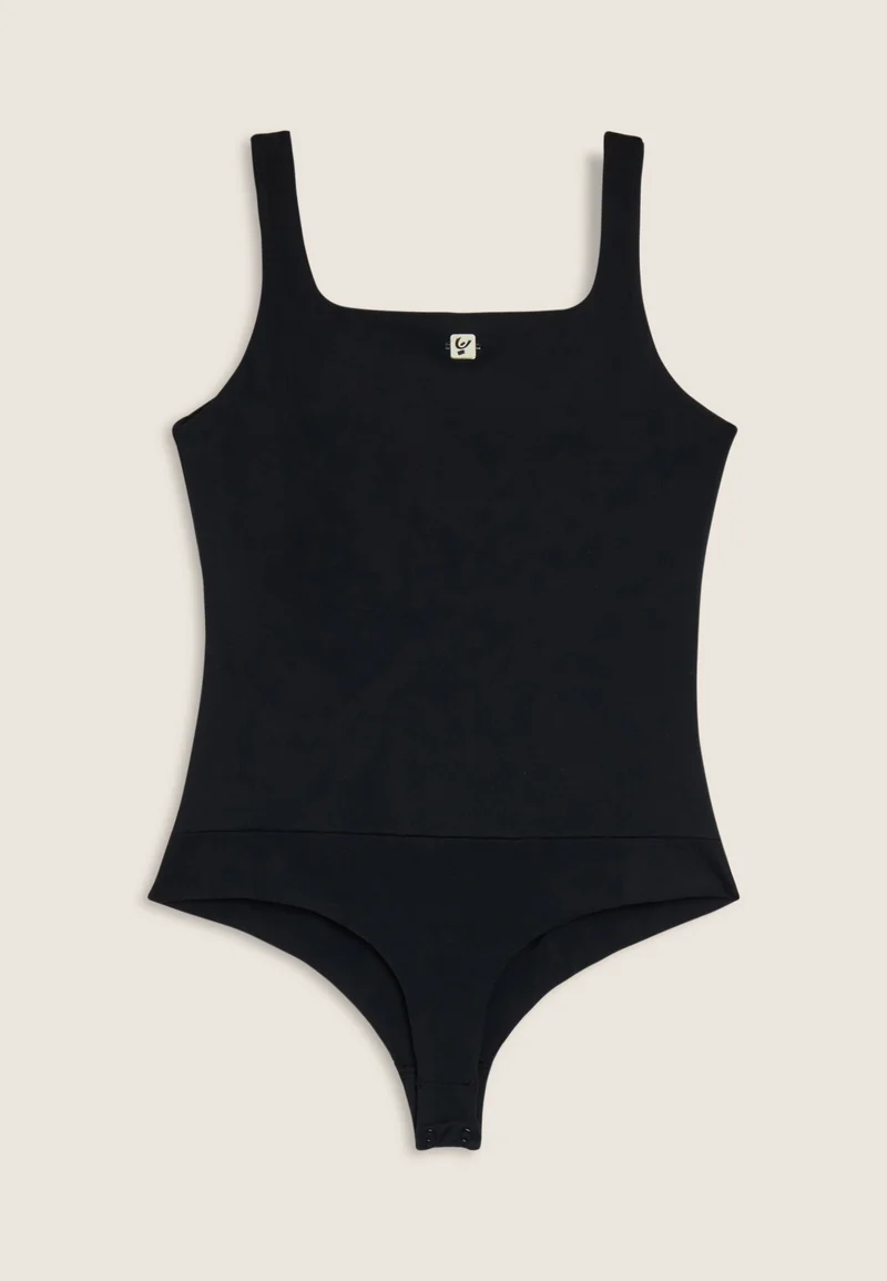 Breathable bodysuit with figure-enhancing seams