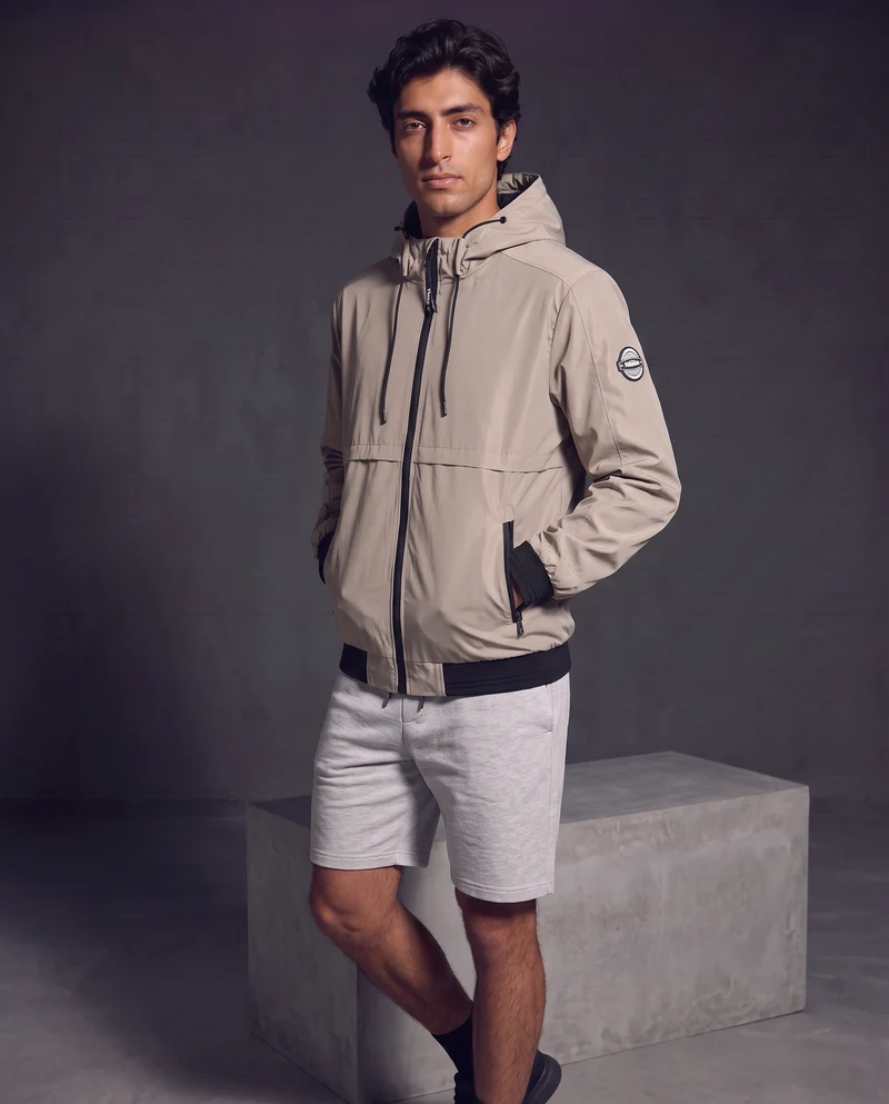 Giubbotto antivento con cappuccio regolabile - Beige