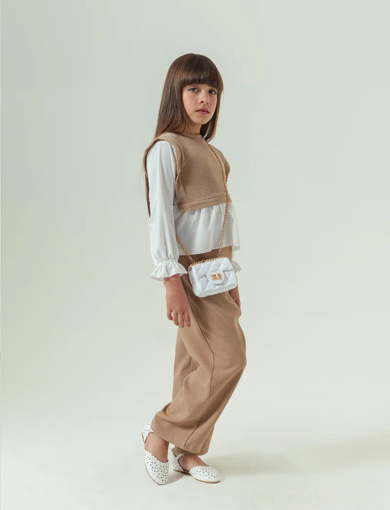 Pantaloni eleganti da bambina in tessuto gessato. - Beige