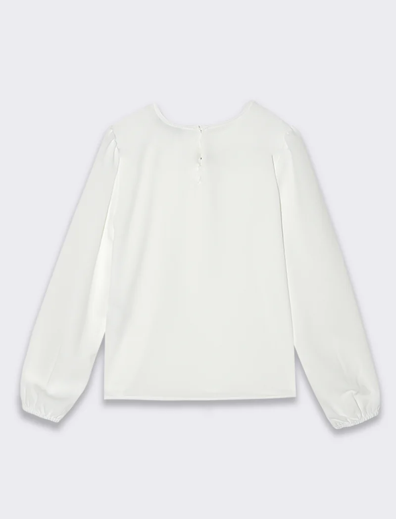 Blusa con fiocco da bambina. - Bianco