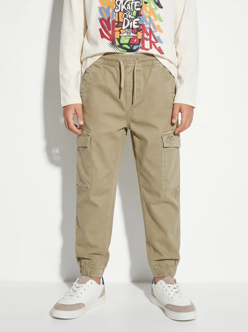 Jogging e pantaloni cargo in maglia - Beige