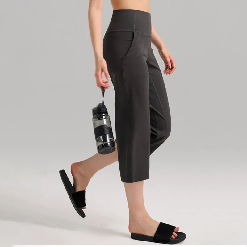 Olivenorma Caprihose mit hohem Bund, weitem Bein und Taschen – ideal für Yoga und Fitness – Damen