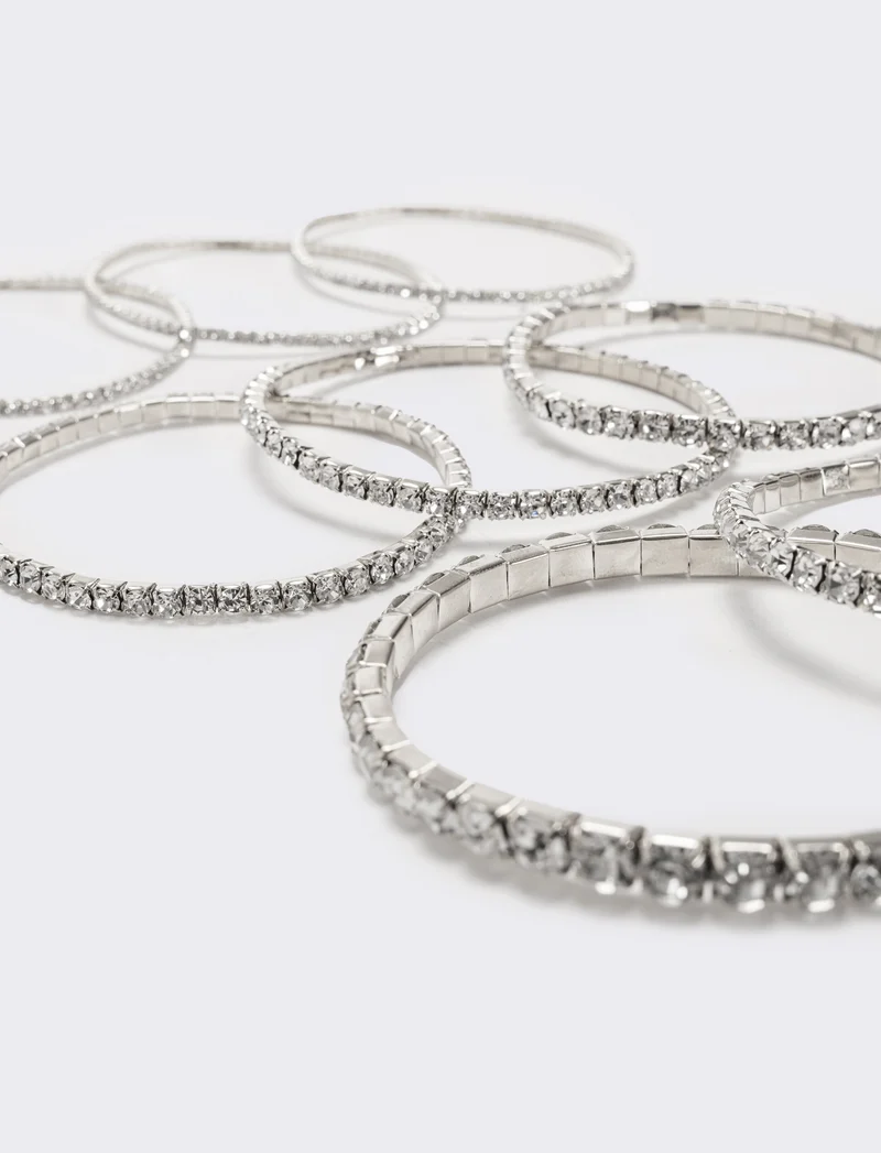 8 bracciali elastici con strass - Argento