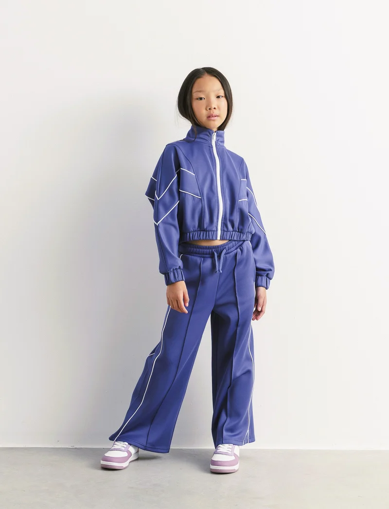 Jogger sport da bambina modello gamba larga con profili a contrasto. - Avion