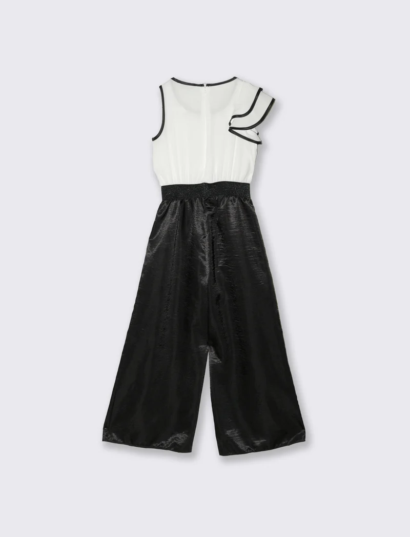 Salopette elegante da bambina con tessuti a contrasto. - Nero