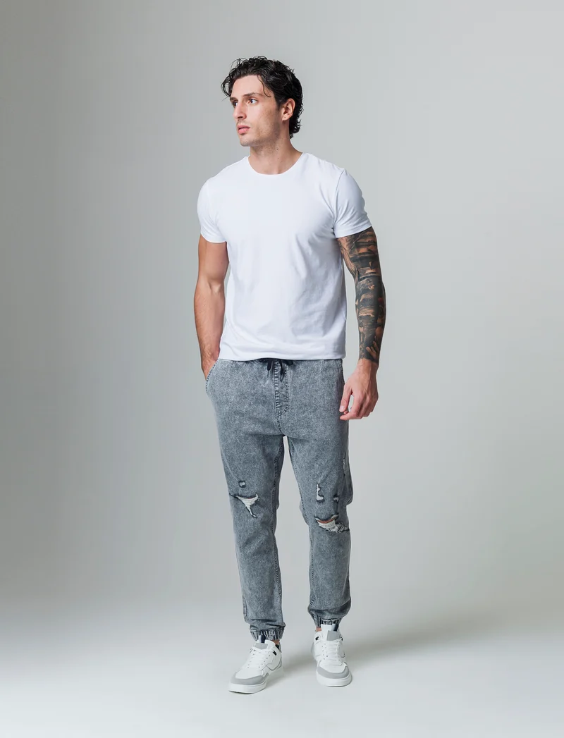 Jeans denim grigio con vita jogger e strappi da uomo - Grigio