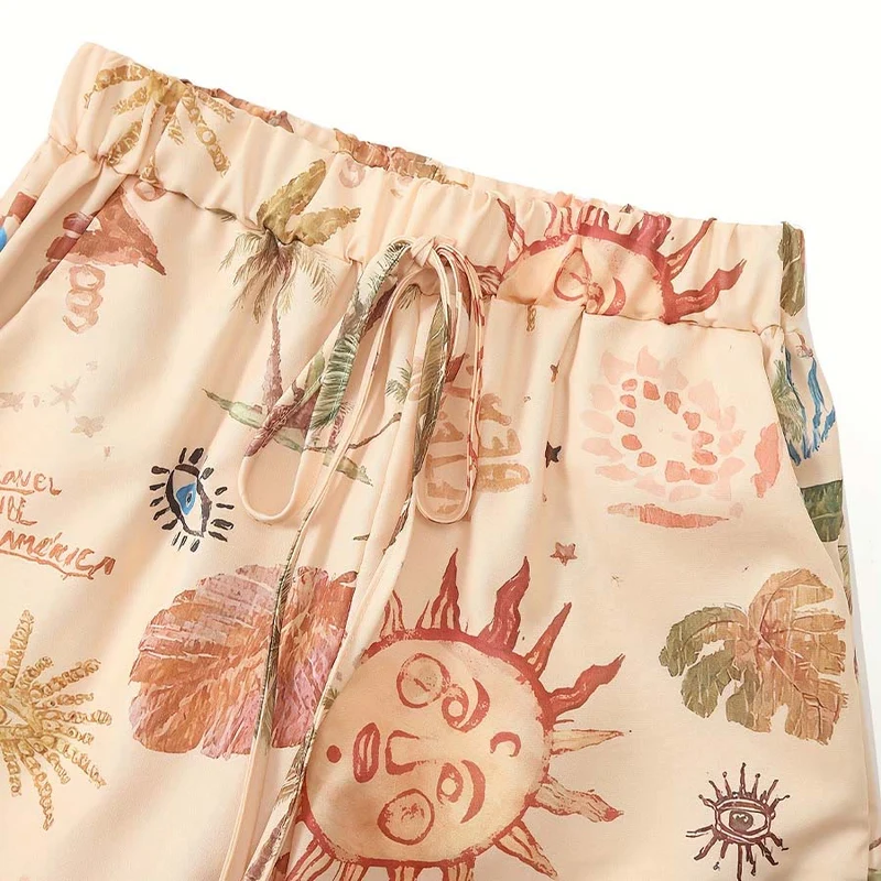 Olivenorma Boho Hose mit Sonnen-, Nazar-Blick- und Palmenprint, weitem Bein und Kordelzug für Damen