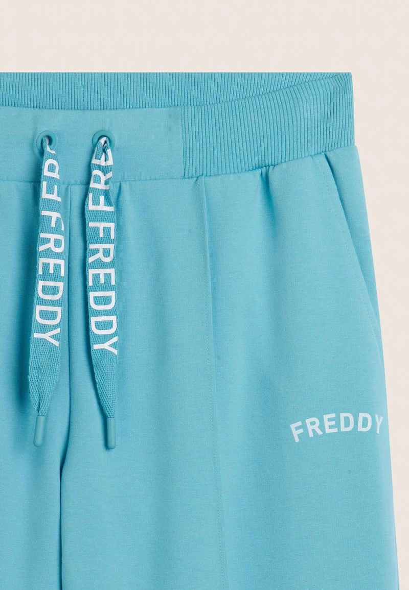 Wide leg trousers with FREDDY logoed drawstring - Milky Blue