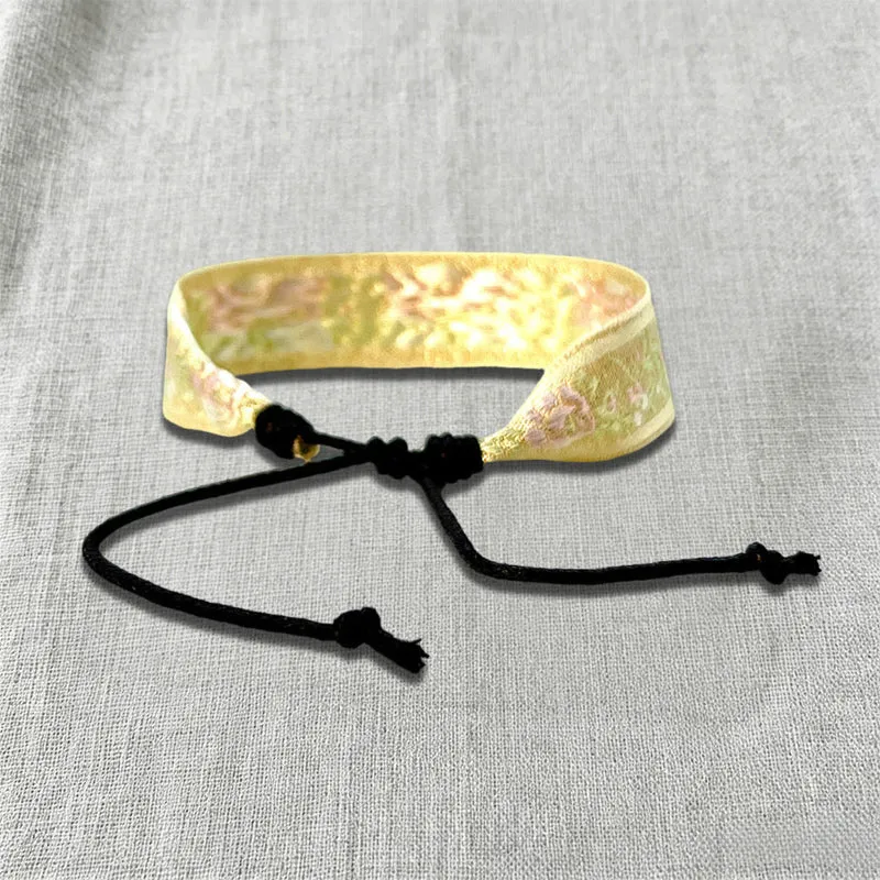 Olivenorma Armband mit kunstvollem Stammesmuster, handgewebt, ethnisch geflochten
